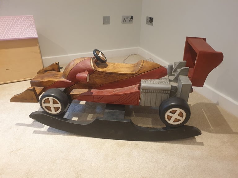 Solid wood rocking car