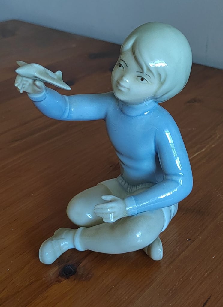 image for NAO FIGURINE BOY WITH AEROPLANE 