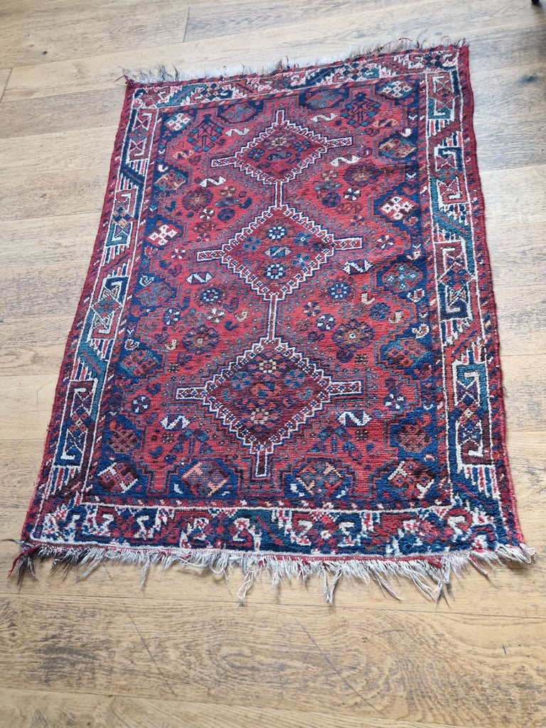 an antique handmade wool persian rug 