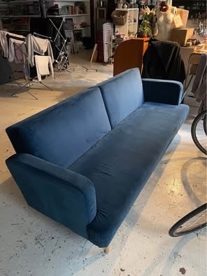 Blue velvet click clack sofa bed