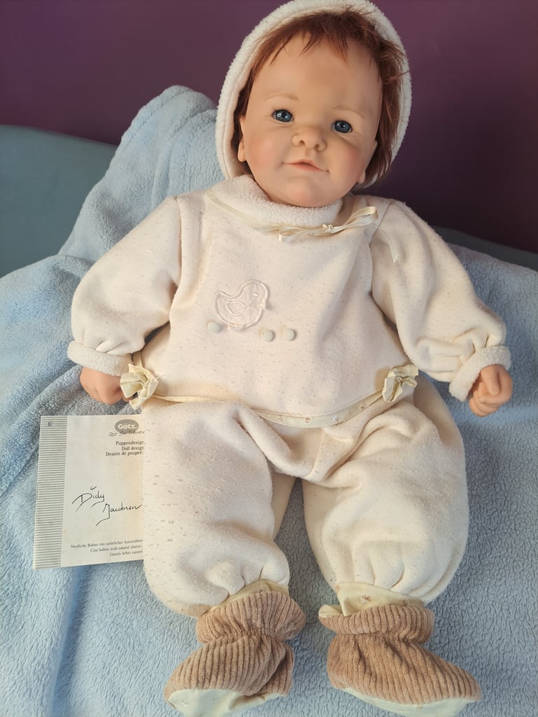 Collectable baby dolls and antique style pram