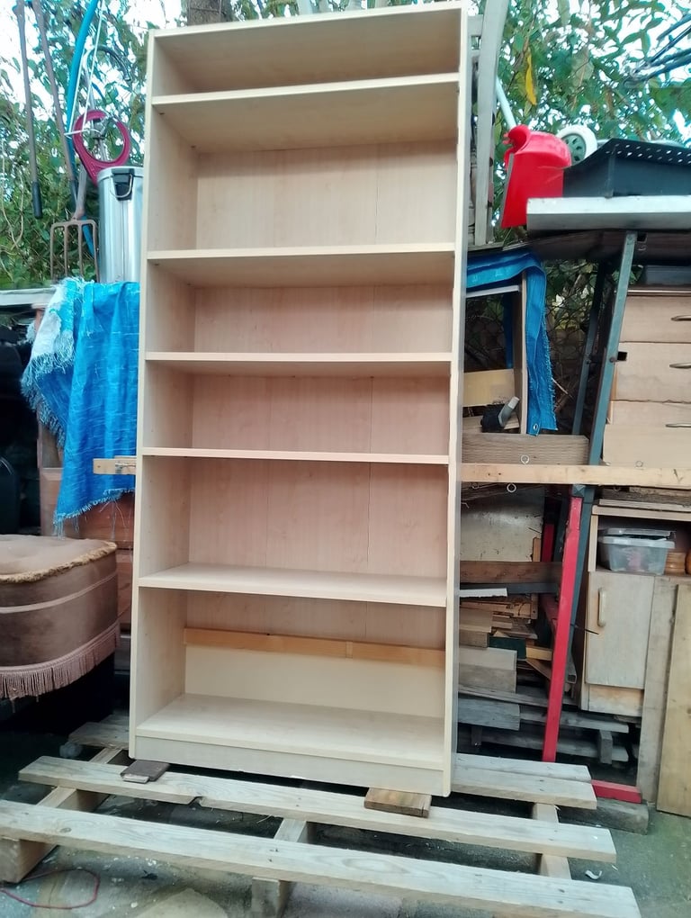 Very tall shelving unit in new condition spotlessly clean inside and out 