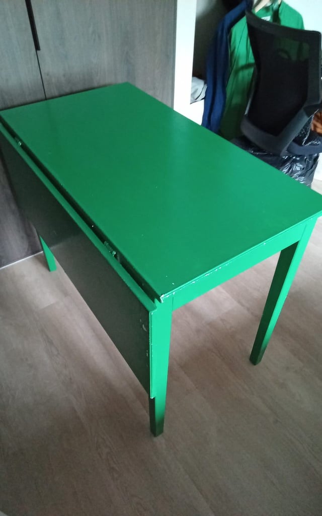 Green extendable table with drawer