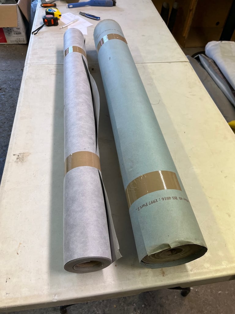 Rolls of building paper and vapour barrier