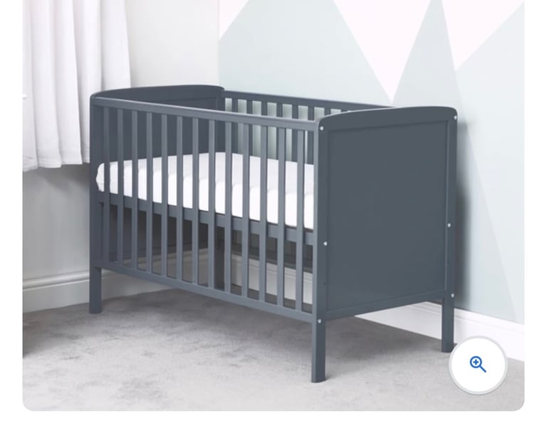 image for Baby cot complete with mattress 