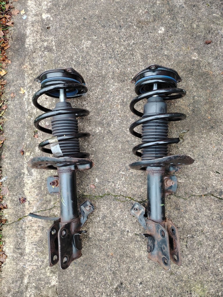 Nissan Nv200 front strut shock absorber assembly both