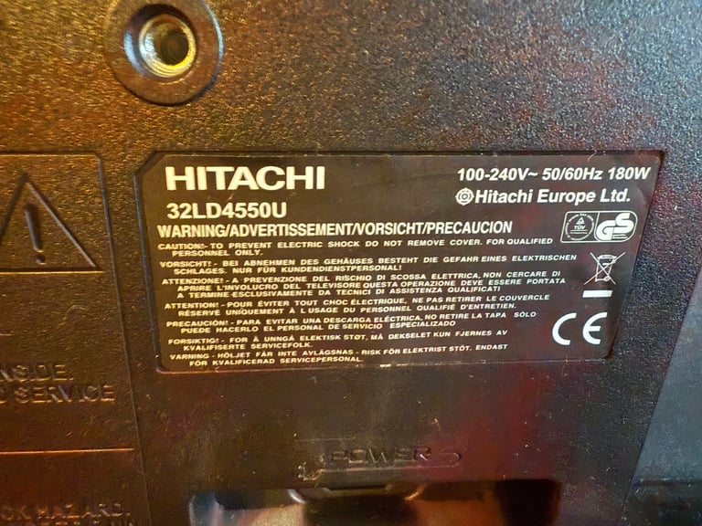 Hitachi 32” TV (32LD4550U) with remote and books