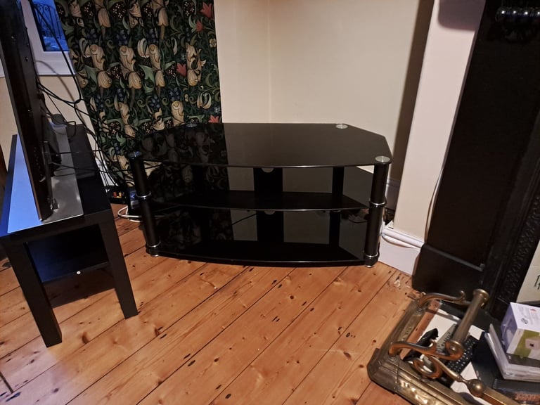 Sleek black glass chrome TV stand