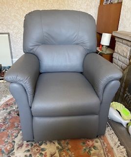 Dual motor rise and recline armchair.