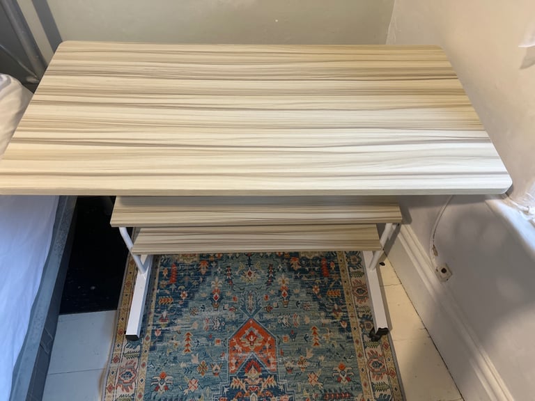 Adjustable height desk with wheels and shelves
