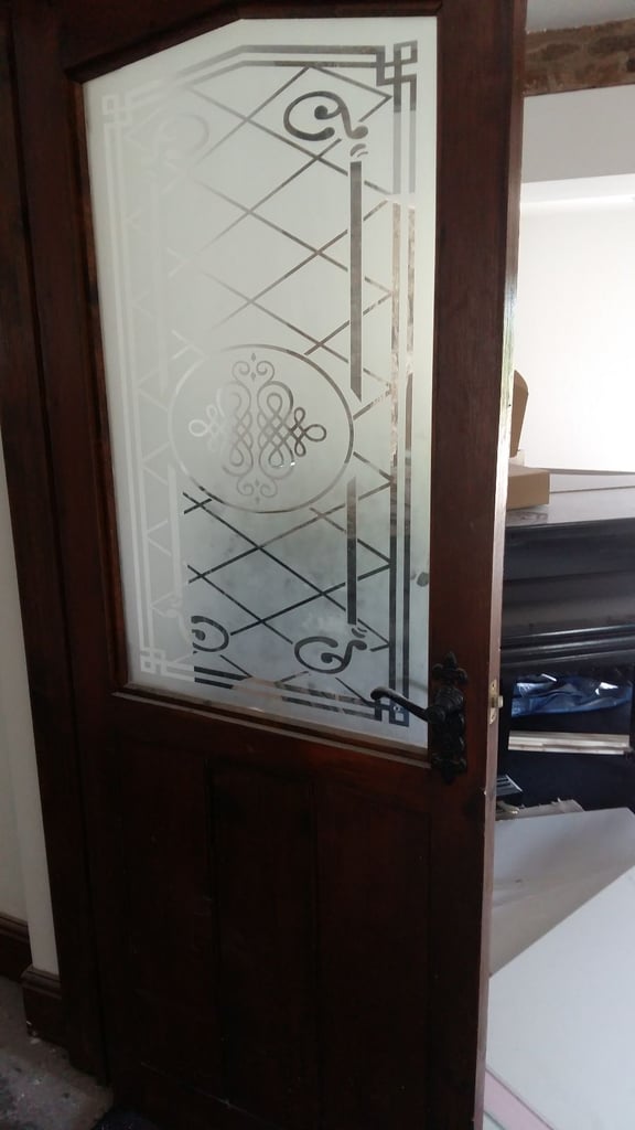 Door with etched glass bespoke made in an oak finish with handles and hinges