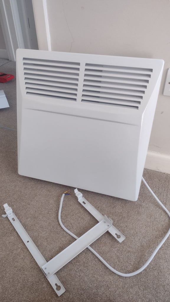 Nearly new hardly used 1kw electric programmable panel heater wall mounted