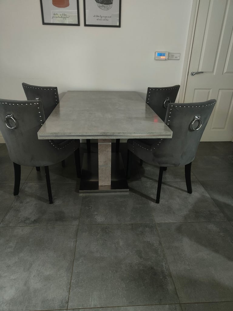 Faux marble dining table and 4 upholstered chairs 