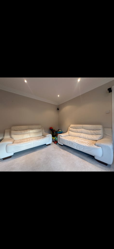 Natuzzi  2 x 2 cream leather sofas 
