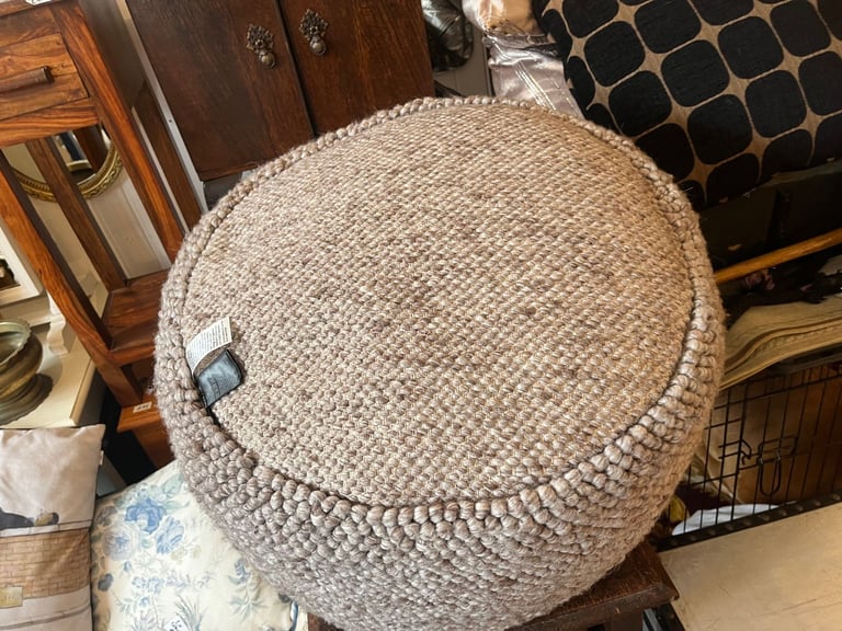 Large wool pouffee in grey colour in good condition . 