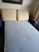 Sofa bed with cushions
