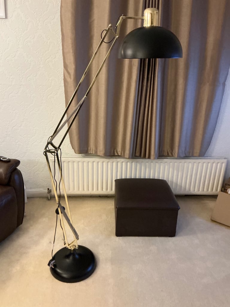 A tall angle poise lamp
