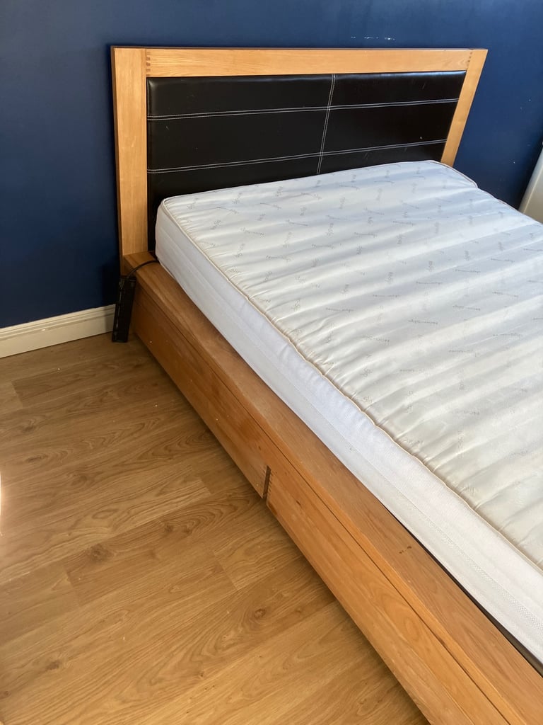 Oak King Size Wooden bed frame with four underbed wheeled drawers 