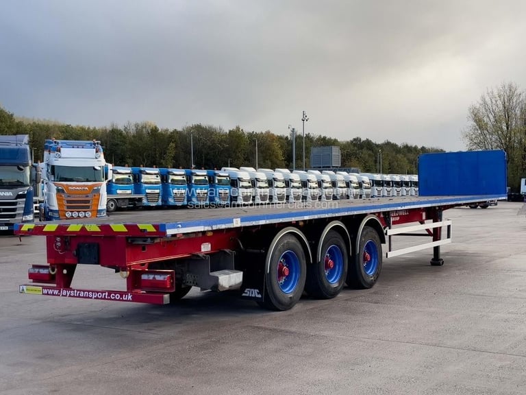 SDC TRI AXLE FLAT BED TRAILER 