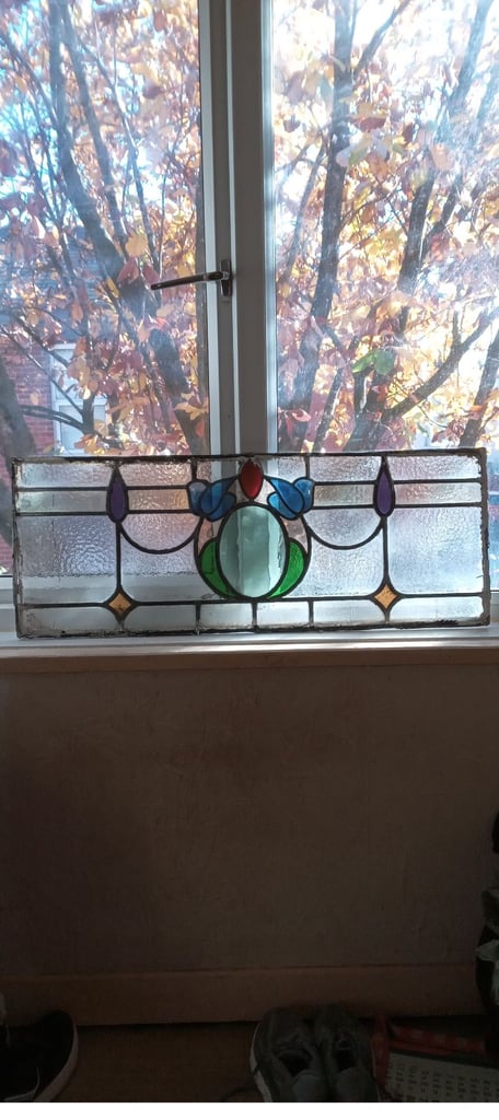 Beautiful coloured stained glass panel .