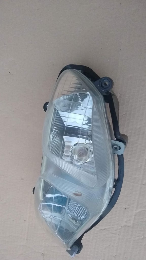 PGO T-Rex moped scooter headlight, new condition.