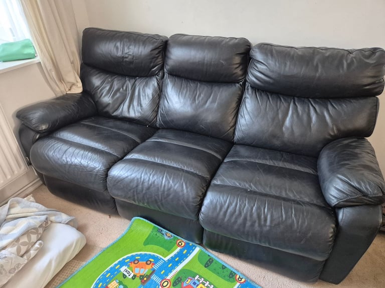 Black leather reclining 3 seater sofa 