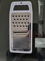 image for A Basic EBAY 'Flat Grater'. Handheld. Stainless Steel. Unused.