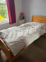 Single wooden bed with pull out guest bed