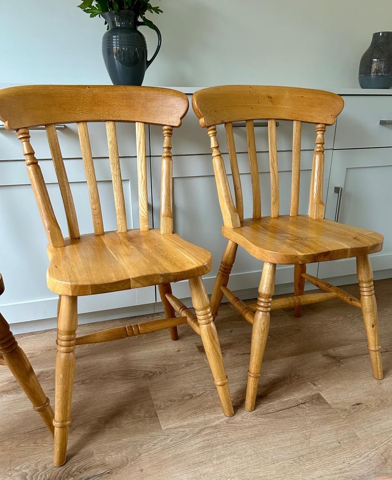 Solid oak dining table and four chairs