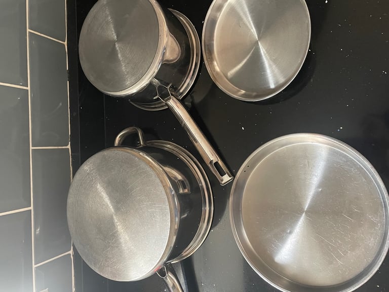 4 Pots & Pans. 3 Saucepans, 1 Stock Pot.  Stainless Steel. Oven/hob/gas/electric/induction safe.
