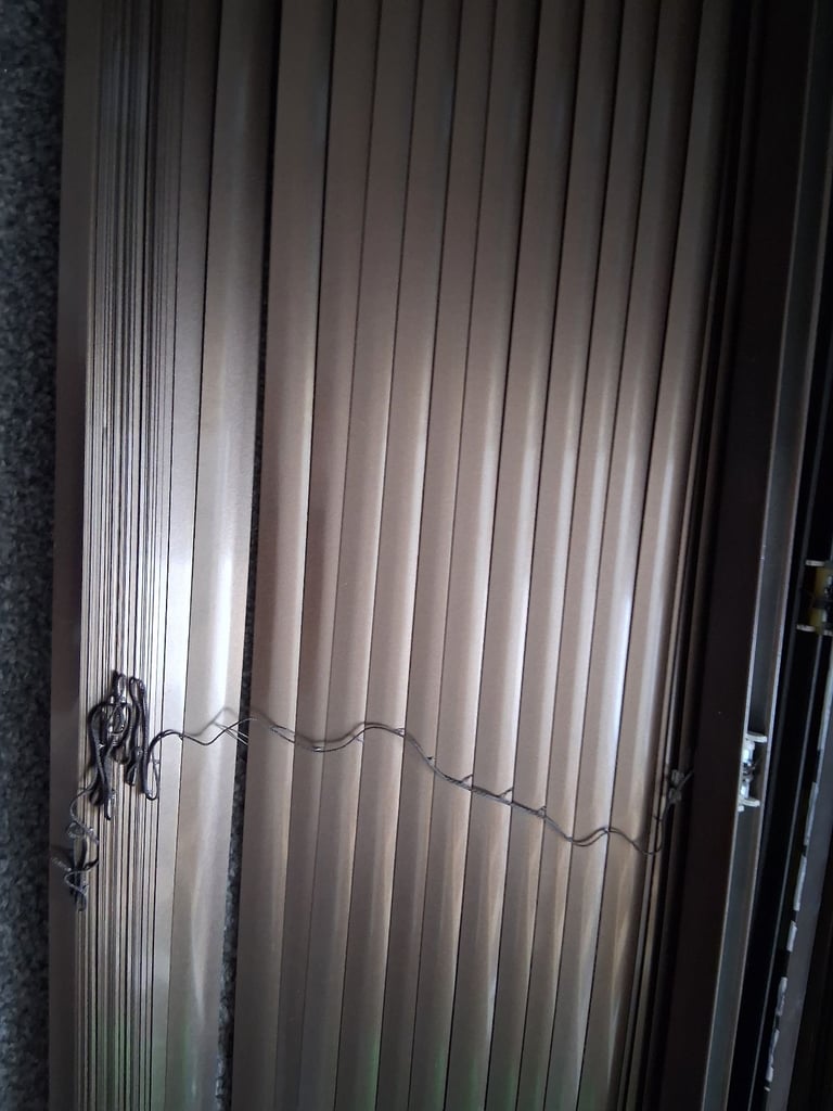 2. Brown Venetian blinds.
