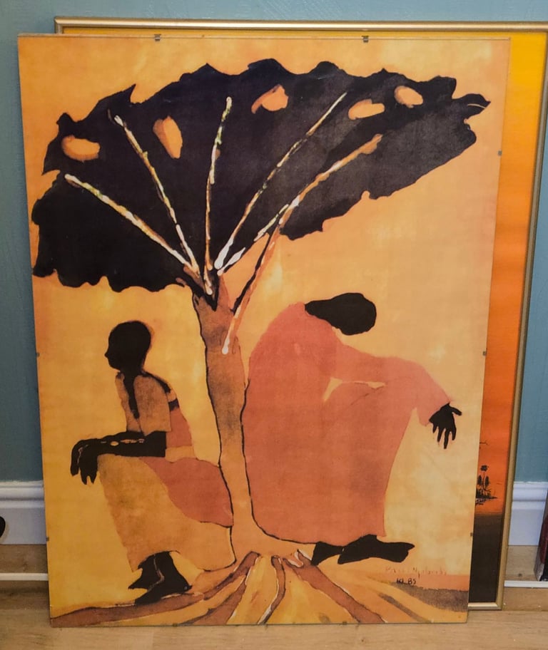 2 x glass framed African themed wall art.