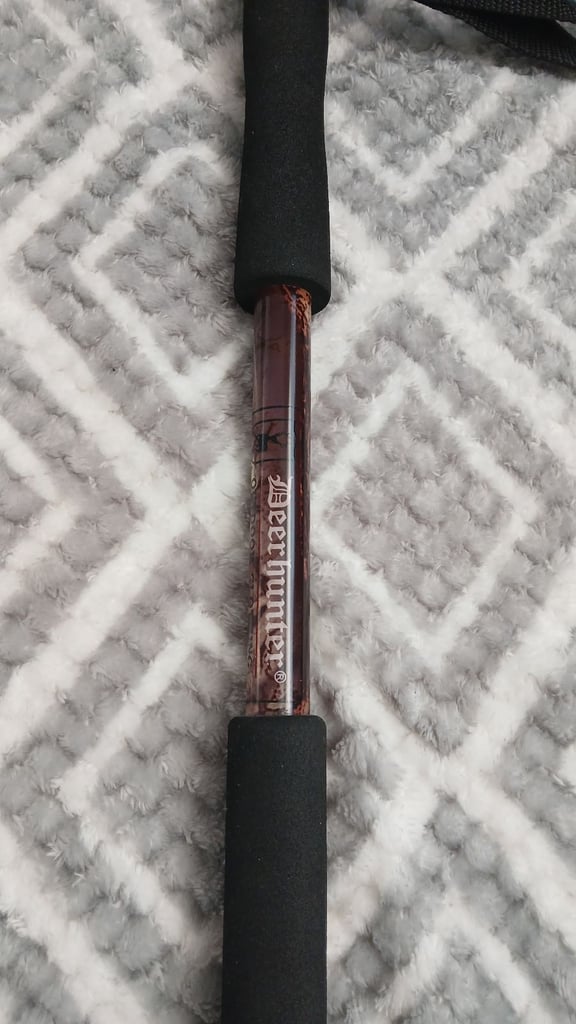 Dear hunter shooting stick