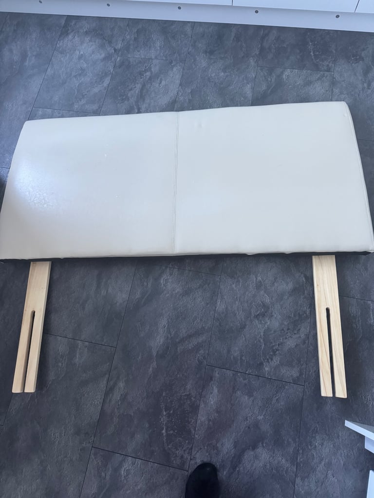 Double cream faux leather headboard. 