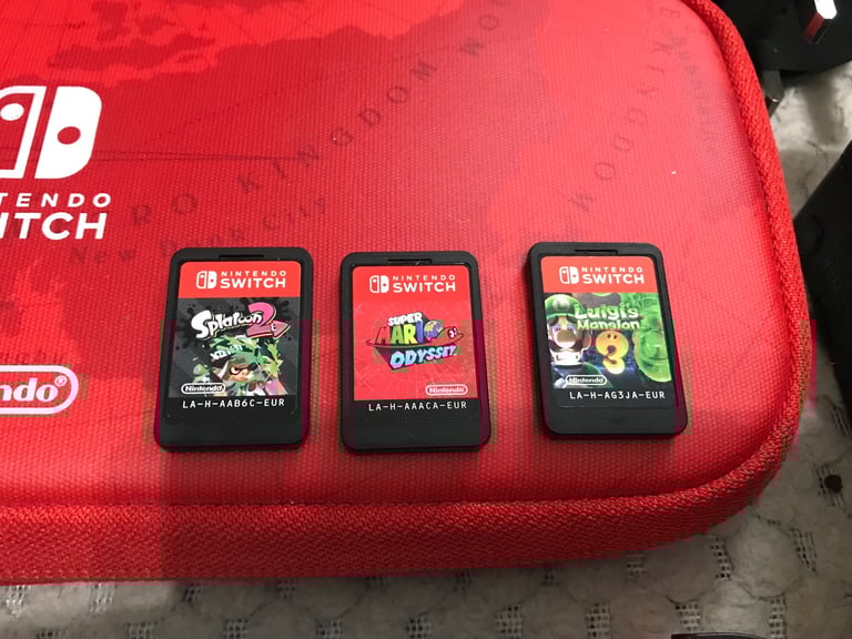 Nintendo Switch console with 3 games