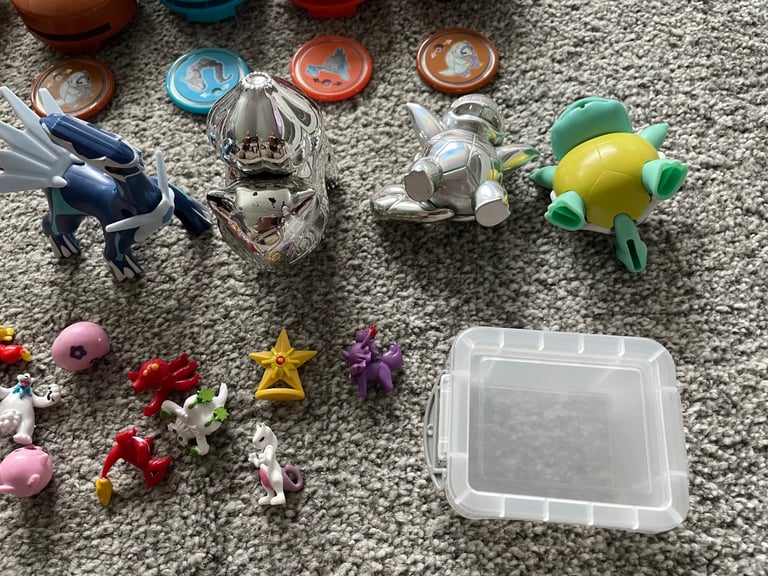 Job lot of pokemon balls figures belt disc launchers