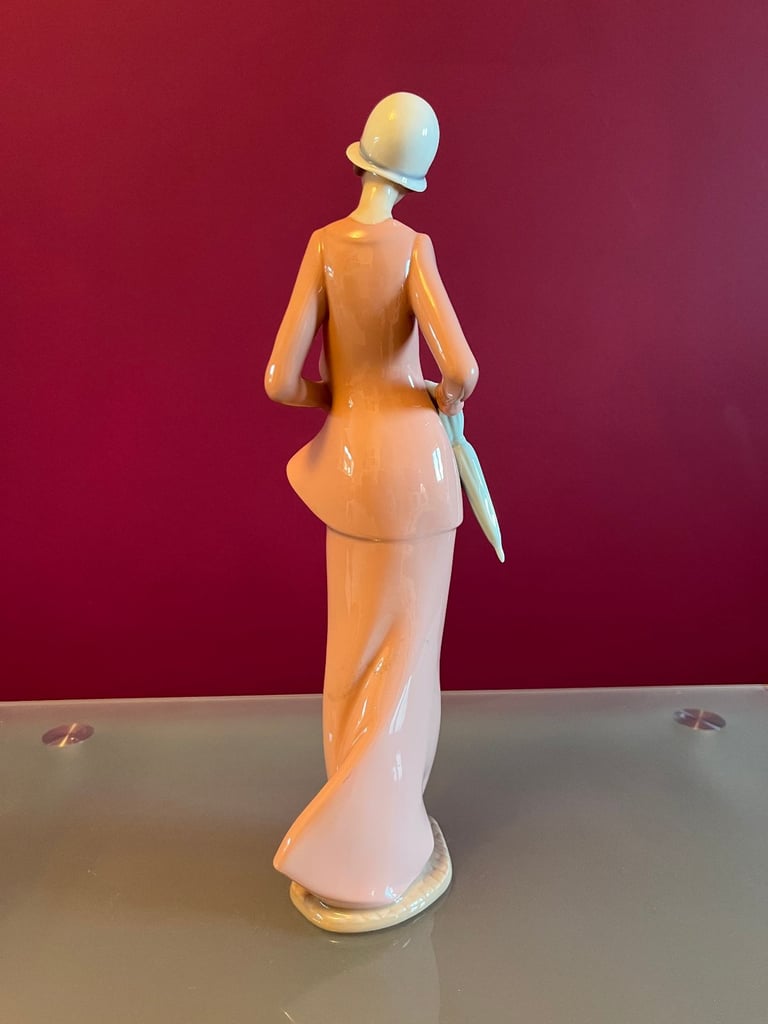 NAO Figurine - Woman, in 1920s outfit, carrying a cat & umbrella