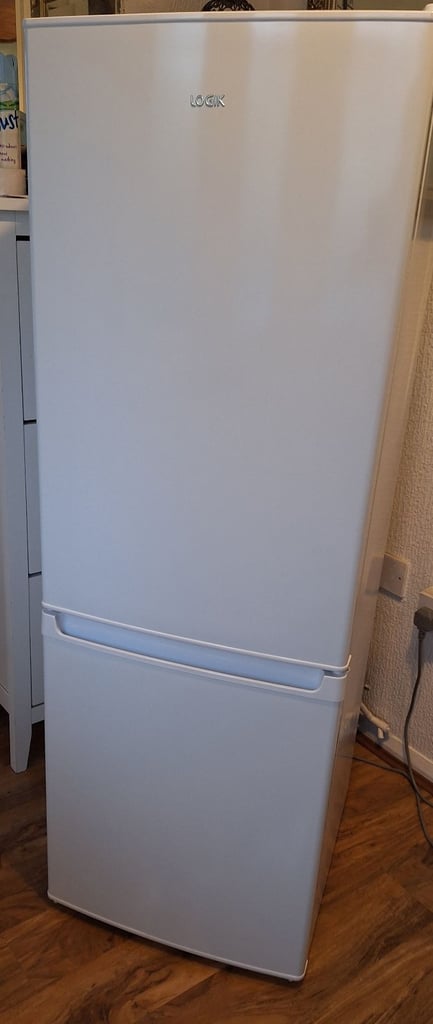 LOGIK fridge freezer size  H 142cm like new one year old 