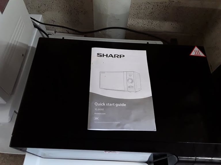Black Sharp YCGG02 microwave oven & grill Low Cost Moves 2nd Hand Furniture STALYBRIDGE SK15 3DN