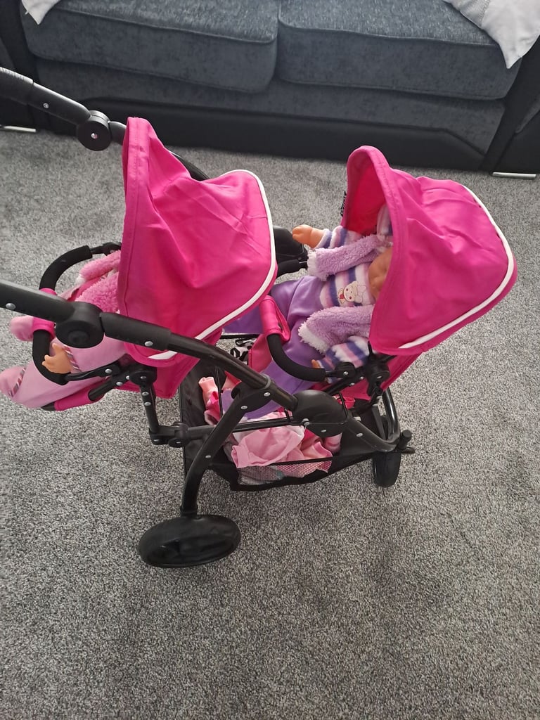 Childrens twin buggies with twin dolls 