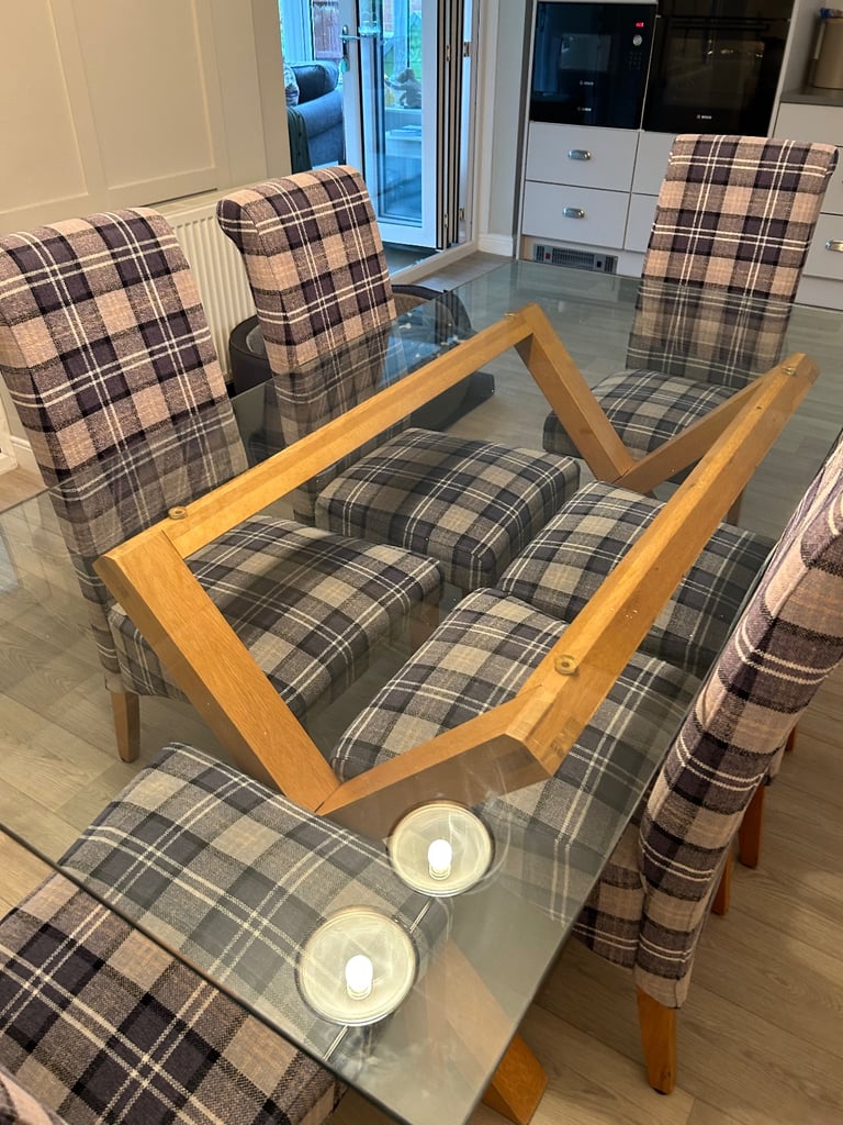 Very good condition, large glass dining table and six chairs for sale