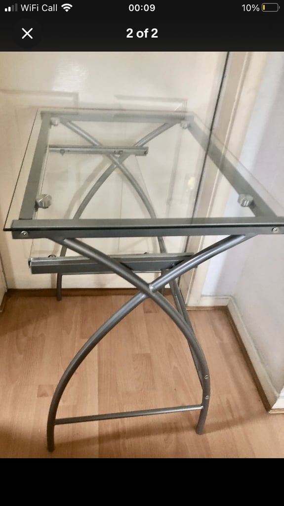Glass computer desk with a sliding table 