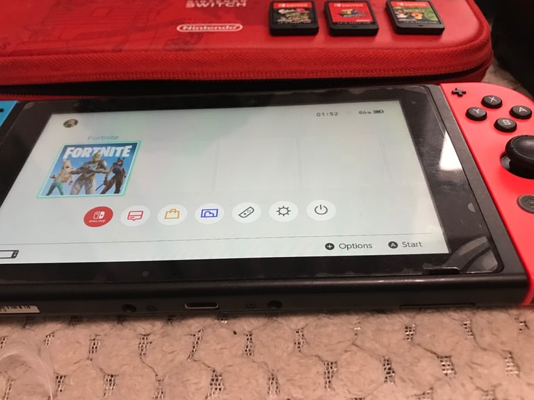 Nintendo Switch console with 3 games