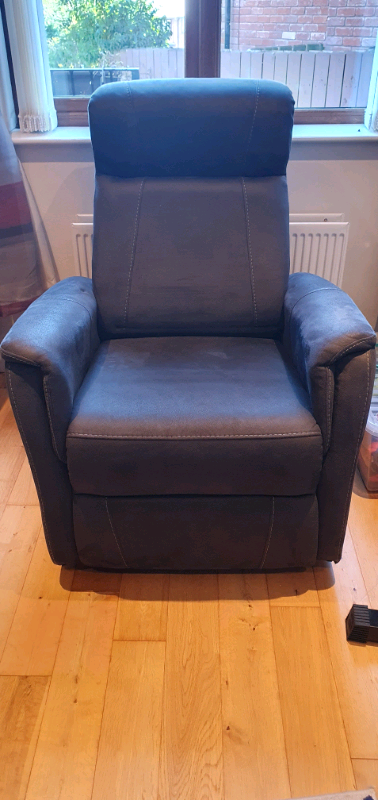 Grey swivel recliner armchair