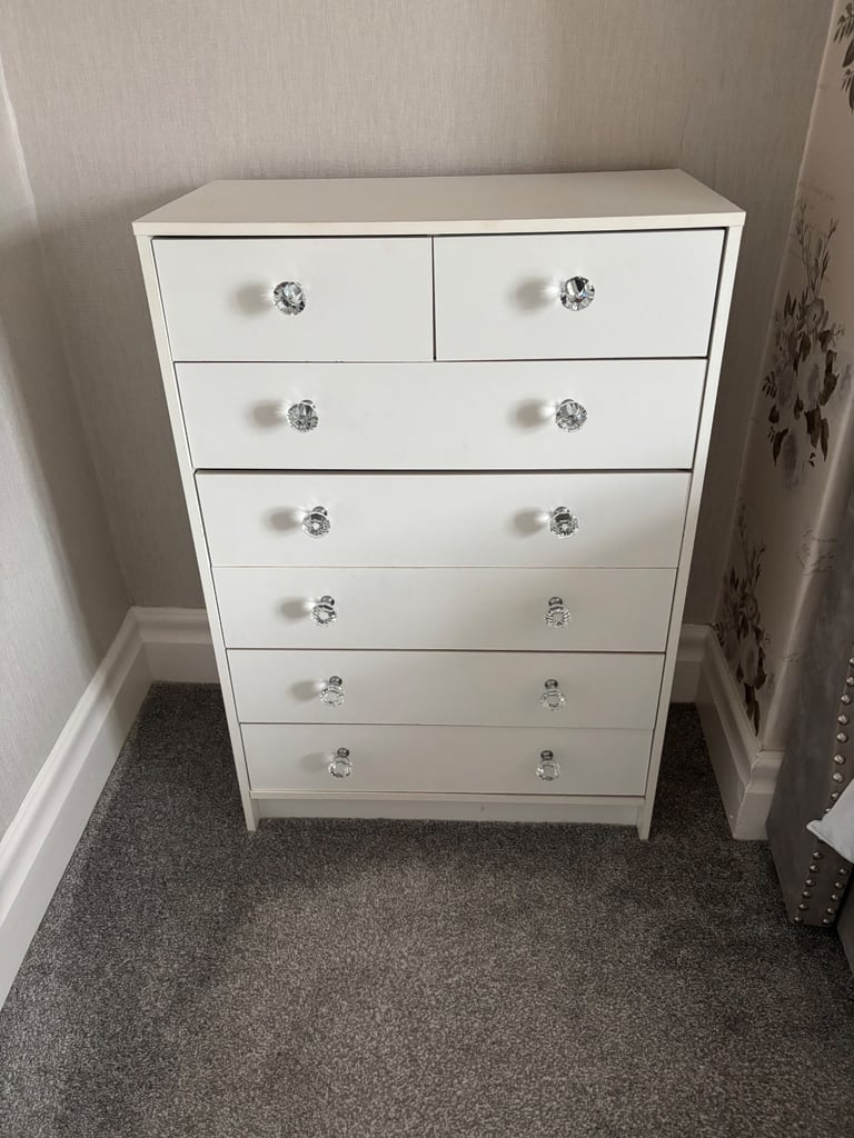 Tall white chest of drawers