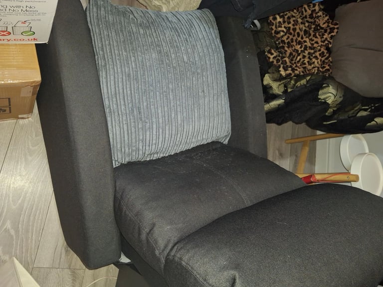 2 black arm chairs, standing up extender for desk and a pink desk with stool.