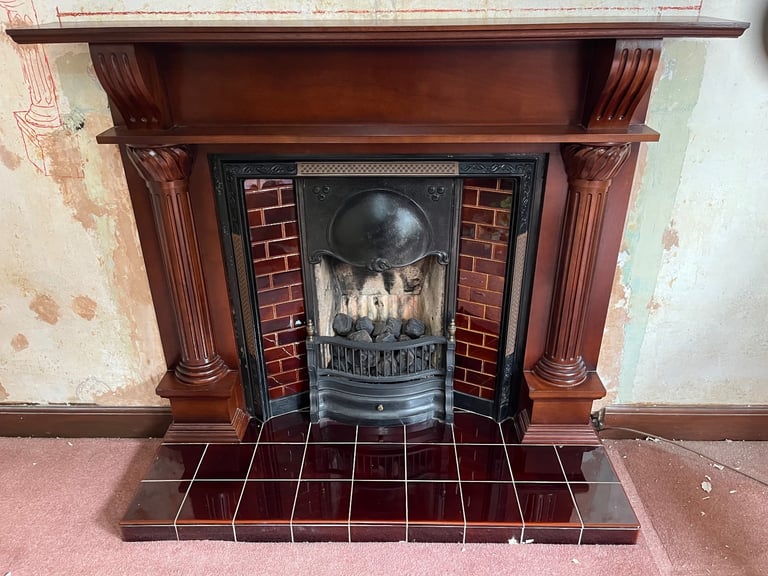 Wooden mantle/ fire surround  with cast iron fireplace 