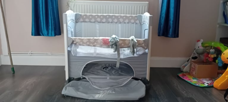 New and unused travel cot . Bedside crib.