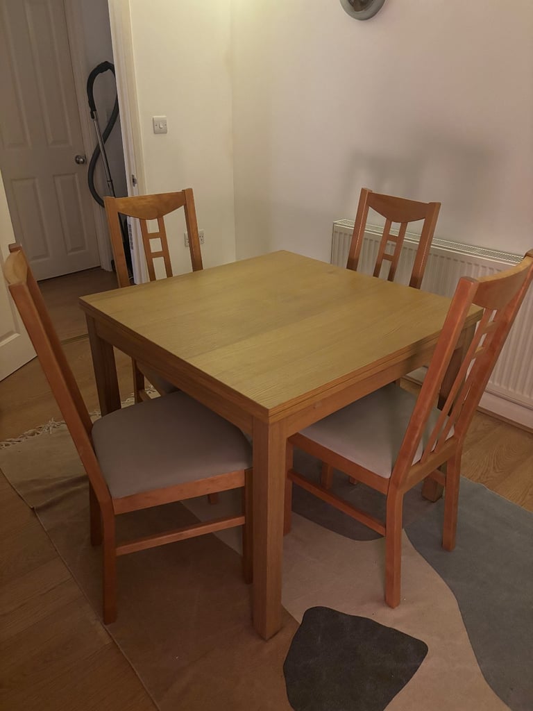 image for IKEA oak dining table and chairs 