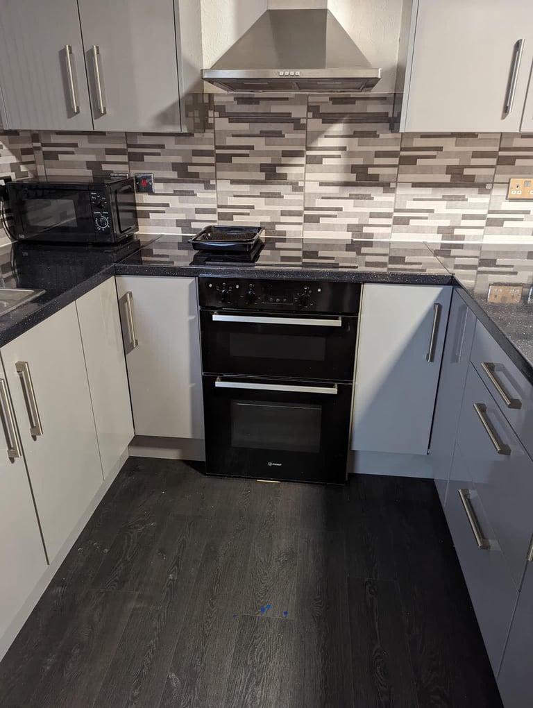 Room with separate kitchen. 